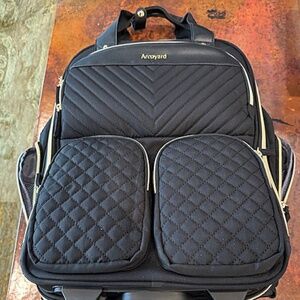 Arcoyard Rolling Computer Bag that will fit it in overhead storage on airplanes